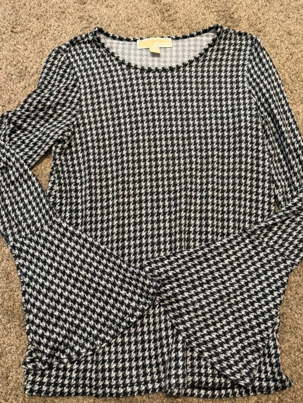 Michael Kors Black & White Houndstooth Long Sleeve Top with Subtle Fluted Cuffs.